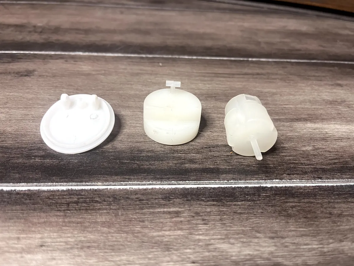 Air release valve float and related injection moulded plastic components